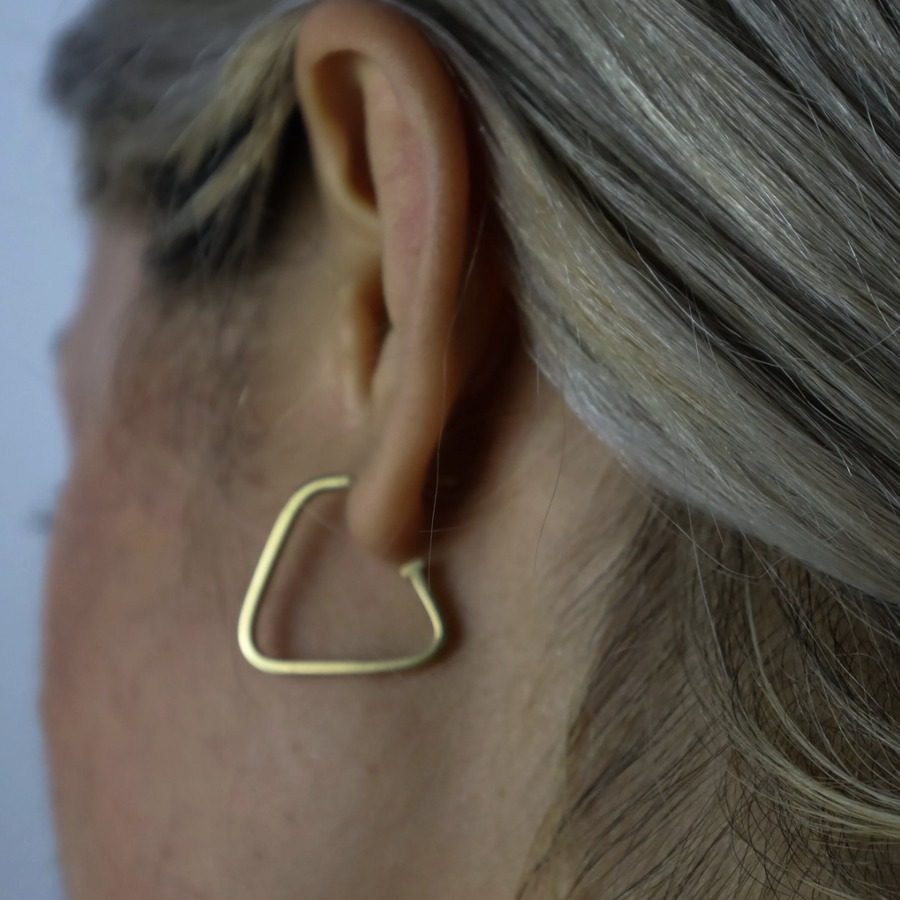 Perfectly Mismatched Gold Hoop Earrings one triangular one round in 18 karat yellow gold by Nelly Creative Studios NYC